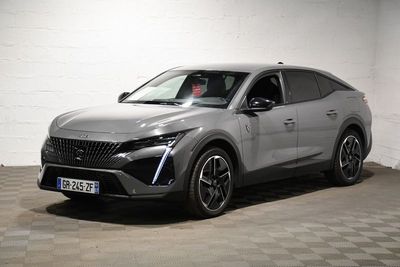 the silver suv is parked in a white room with checkered flooring