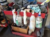 a red cart filled with bottles and cleaning supplies