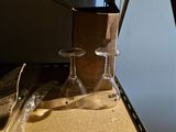 two empty wine glasses sitting on a counter