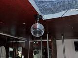 a disco ball hanging from the ceiling in a room