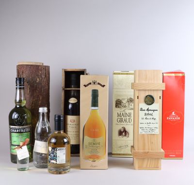several bottles of alcohol are lined up on a white surface
