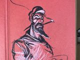 drawing of a man smoking a cigarette on top of a red book