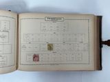 an open book that has a bunch of stamps on it