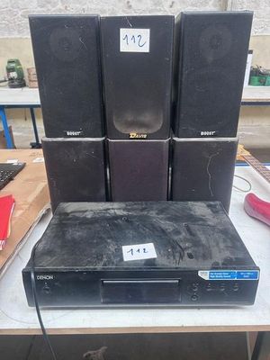 a lot of electronics sitting on a table in a room