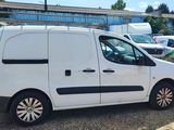 a white van that is parked in a parking lot