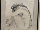drawing of a nude woman sitting on her knees in a black frame