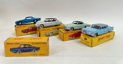 several toy cars are sitting on top of boxes on a white surface