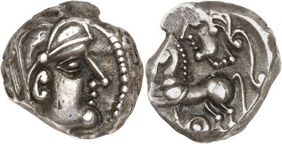 a silver coin with an image of a woman and a horse