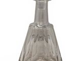 a clear glass bottle with a stopper on top of it