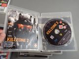 a person holding a cd case with a game on it