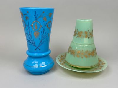 two vases sitting next to each other on a table