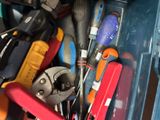 many different tools in a blue box together