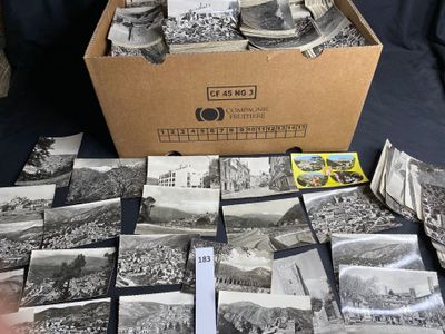 a box full of old black and white photos