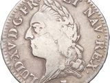 gros plan d'une pièce de monnaie sur laquelle figure une tête de femme