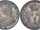 a close up of a coin with a crown on top of it