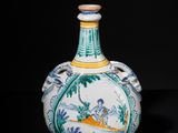 an image of a vase with a bird on it on a black surface