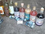 many bottles of alcohol sitting on the floor next to each other