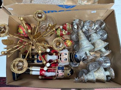 a cardboard box filled with christmas ornaments and ornaments