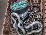 a box with chains and a boat engine in it
