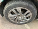 a close up of a tire on a car ' s rim
