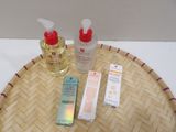 a bamboo tray with a bottle of lotion and a bottle of lotion on it