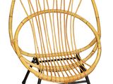 the chair is made of bamboo and has a black metal frame
