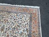 a rug on the ground with a cat laying on it