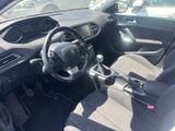 the interior of a small car with a steering wheel and dashboard