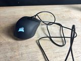 a computer mouse that is sitting on a wooden table