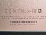 a close up of the back of a laptop with a barcode on it