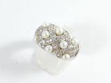 an image of a ring with pearls and diamonds on a white surface