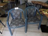 two chairs that are sitting next to each other on the floor