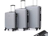 three pieces of luggage sitting next to each other on a white surface
