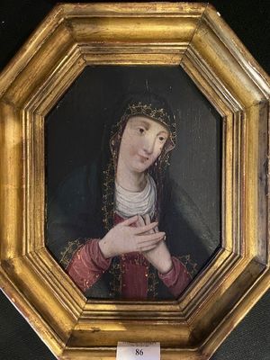 painting of a woman with a crown of thorns in a gold frame