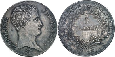 a close up of a coin with a woman ' s face on it