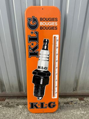 an orange sign with a picture of a spark spark on it
