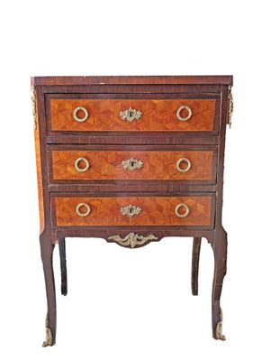 an image of a small chest of drawers on a white background