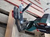 someone is using a tool to cut a piece of wood on a pallet