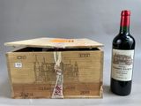 a bottle of wine and a box of wine on a table