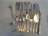 a lot of silver spoons and spoon spoons on the table