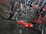 a gym with a lot of machines in the room