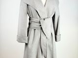 an image of a coat on a mannequin stand