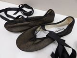 two pairs of shoes that are on a table