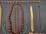 several pieces of jewelry including a necklace, bracelet, and broochet