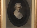 portrait of a woman in a black and white dress in a gold frame