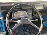 a steering wheel and dashboard of an old car