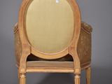 an image of a chair with a beige upholstered back and a beige upholstered seat