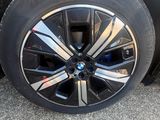 a close up of a wheel on a black car