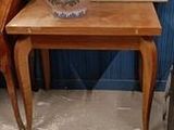a vase that is sitting on top of a wooden table
