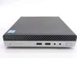 the back view of a laptop computer sitting on top of a white surface